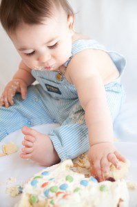 Baby boy with his cake smash cake in Ruislip